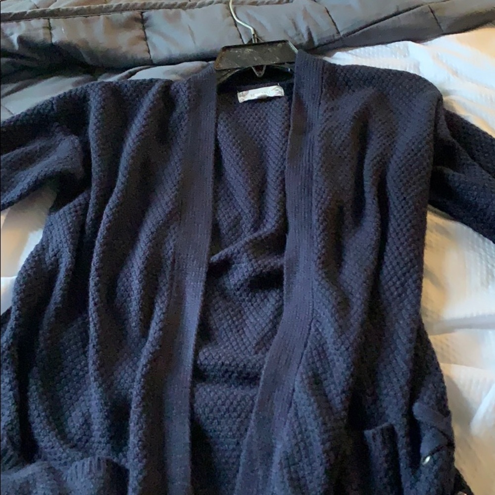 Navy Blue Cardigan. Never worn!! Runs big.